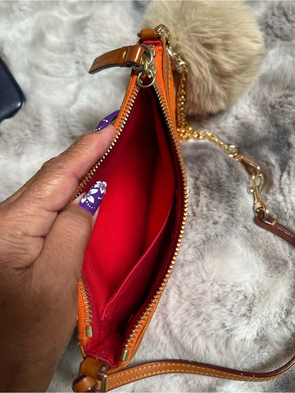 Dooney & Bourke Orange Signature Logo Wristlet with Gold Chain and Pom
